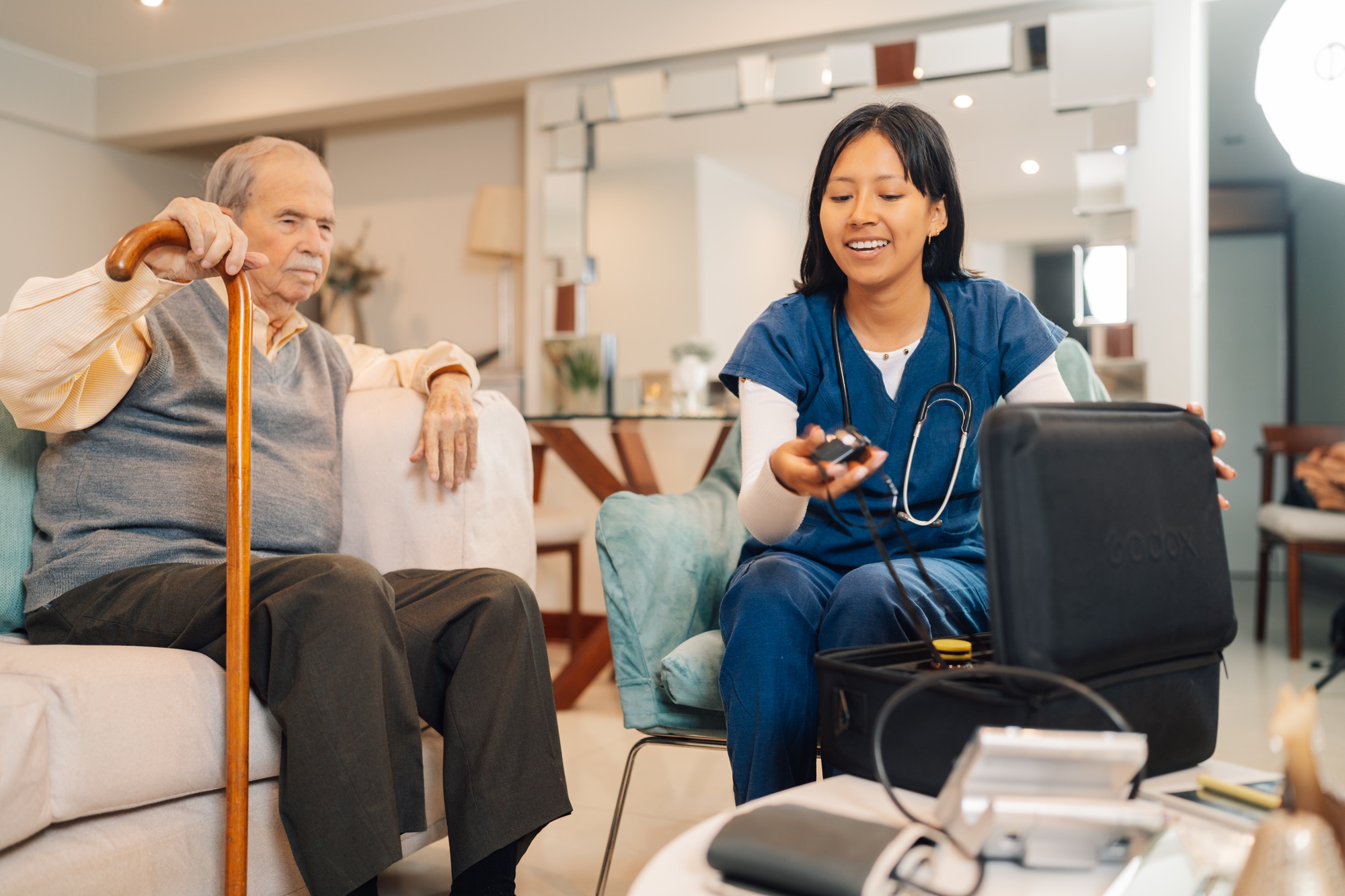 Home nurse preparing blood pressure measure tool